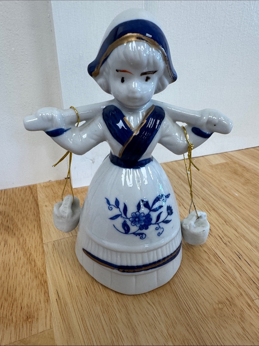 Vintage-Style Blue & White Ceramic Dutch Girl Figurine with Gold Accent
